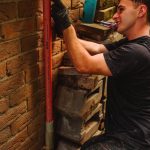 17-richmond-nsw-electrician-fitting-service-conduit-to-brick-wall